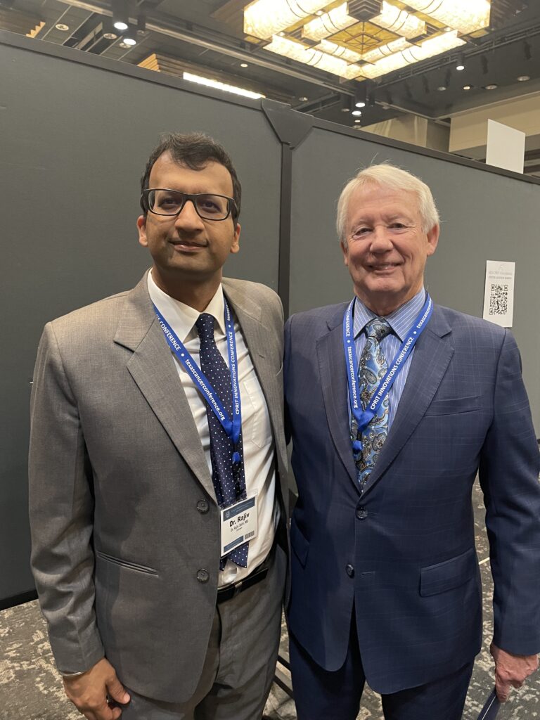Dr. Rajiv Saini engages with Wayne Roberts, CEO of Cancer Prevention and Research Institute of Texas (CPRIT), to explore collaborative efforts in cancer care.